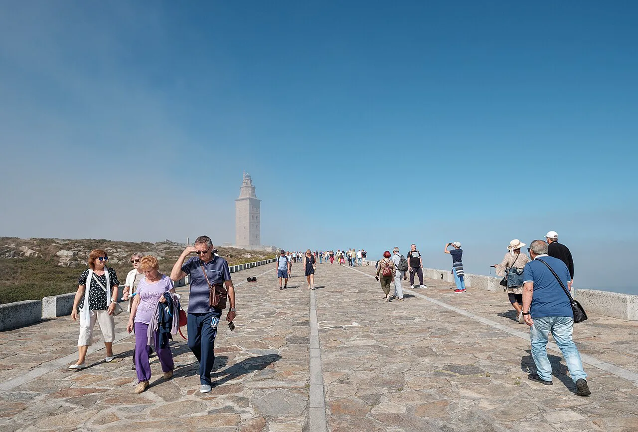 Walkers on the promenade to the Tower of Hercules, A Coruña.