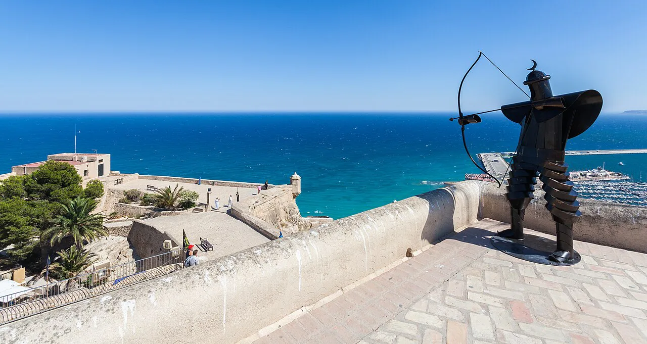 A statue on the ramparts of Santa Bárbara Castle overlooking the sea, Alicante.