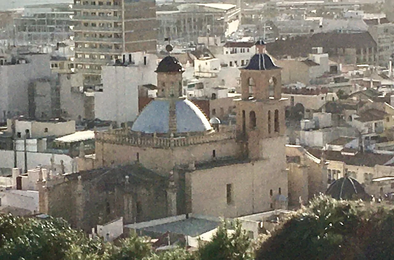 The Co-Cathedral of San Nicolás among the rooftops of Alicante.