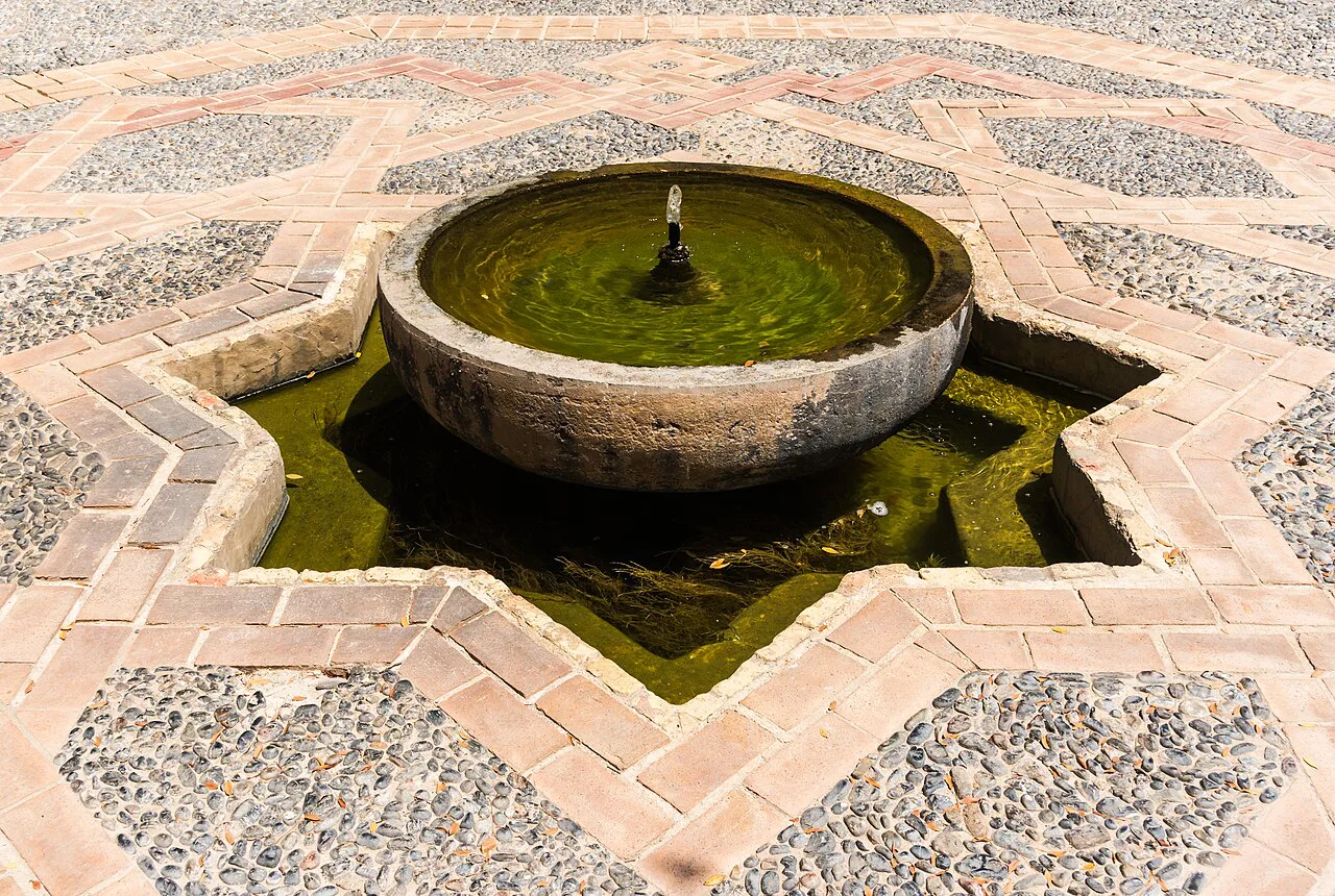 A star-shaped fountain in the Alcazaba gardens, Almería.