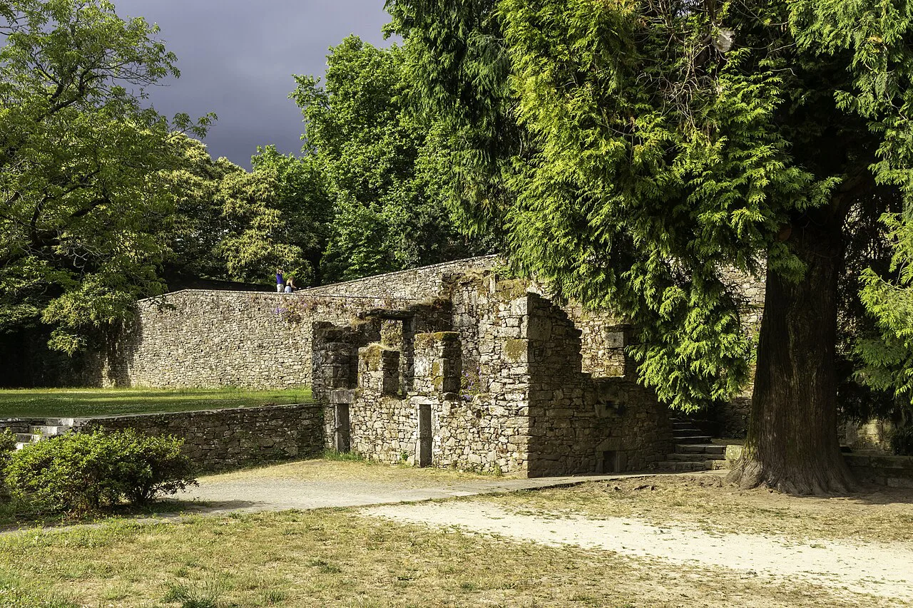 Old stone walls among trees in the Parque de Bonaval, Santiago de Compostela.