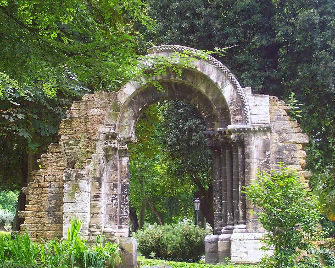 The Romanesque portal of San Isidoro in the Campo de San Francisco park, Oviedo.