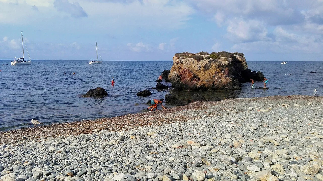 A rocky islet off a pebble beach on Tabarca Island.