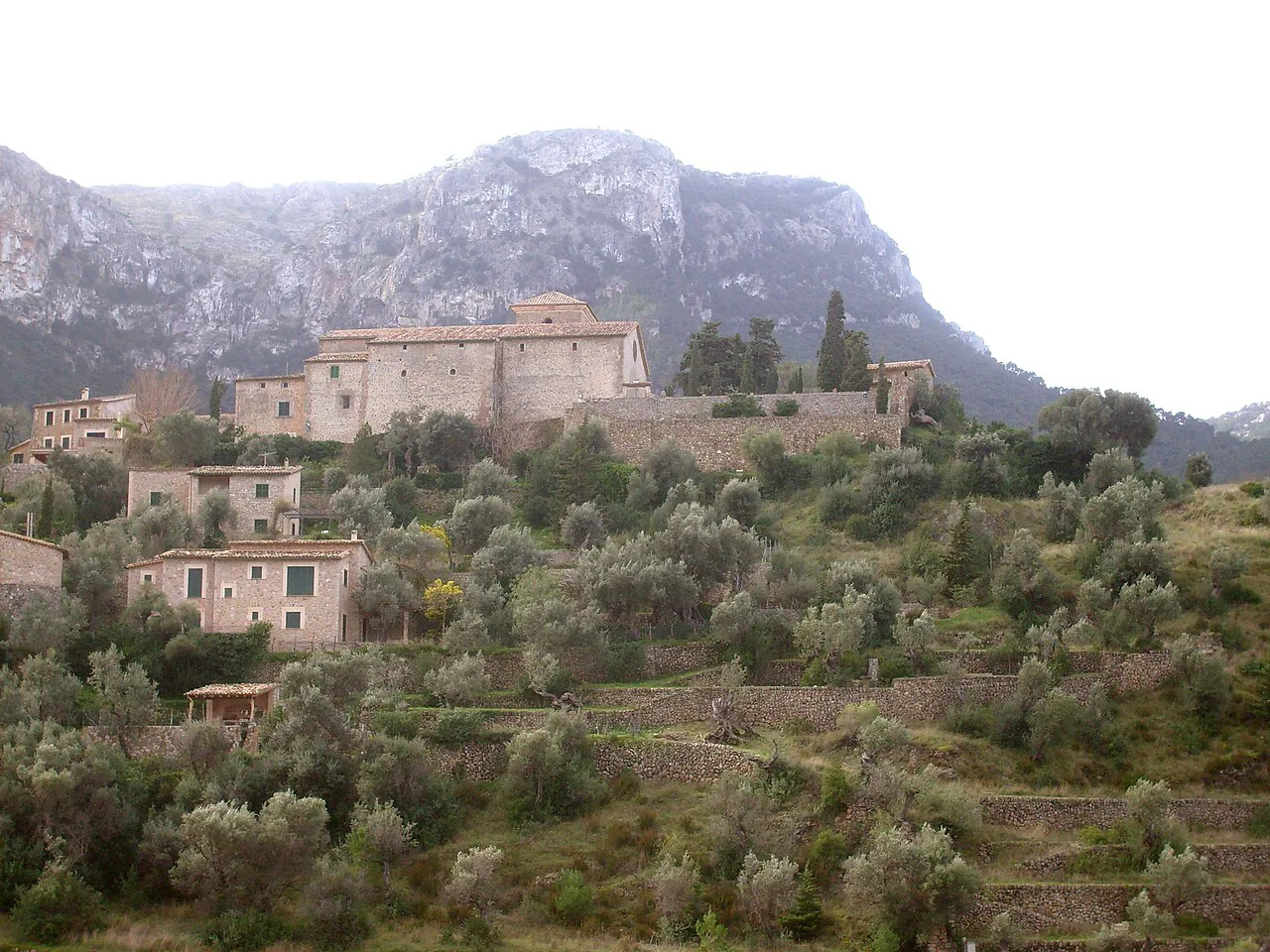 Deià's church hill below the Tramuntana mountains.