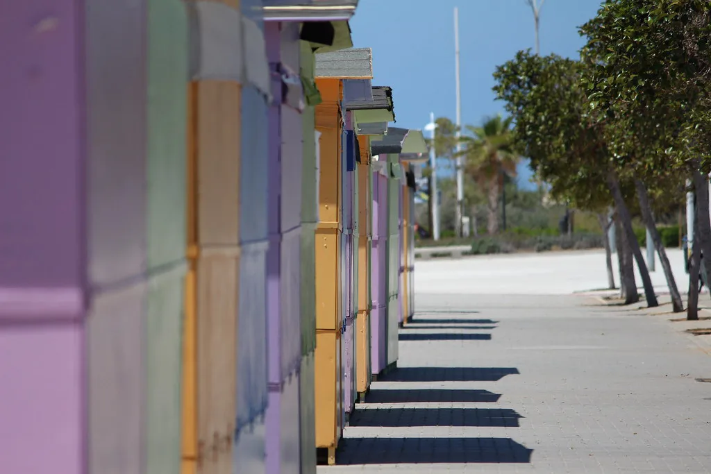 A row of colourful beach huts in Dénia.
