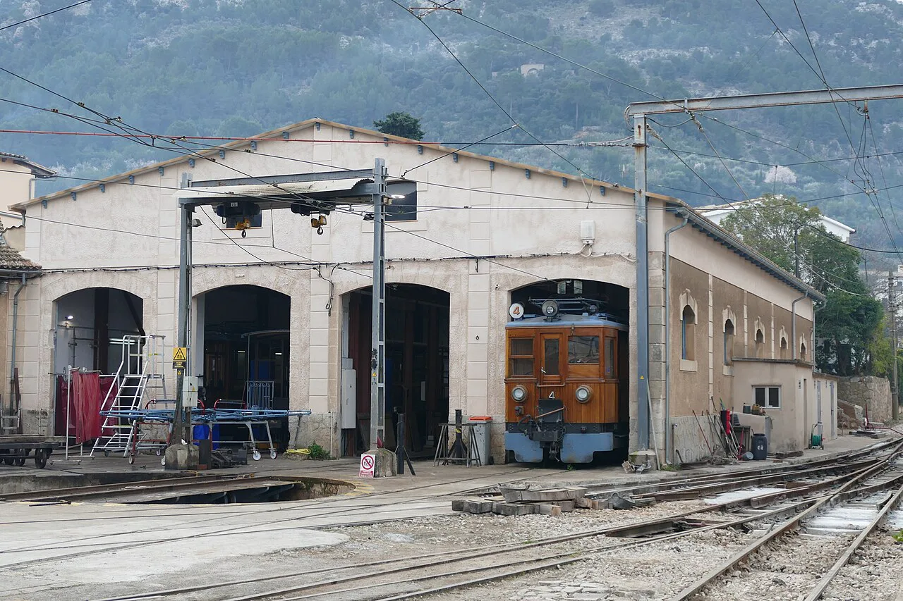 The depot of Sóller train station with a train inside.