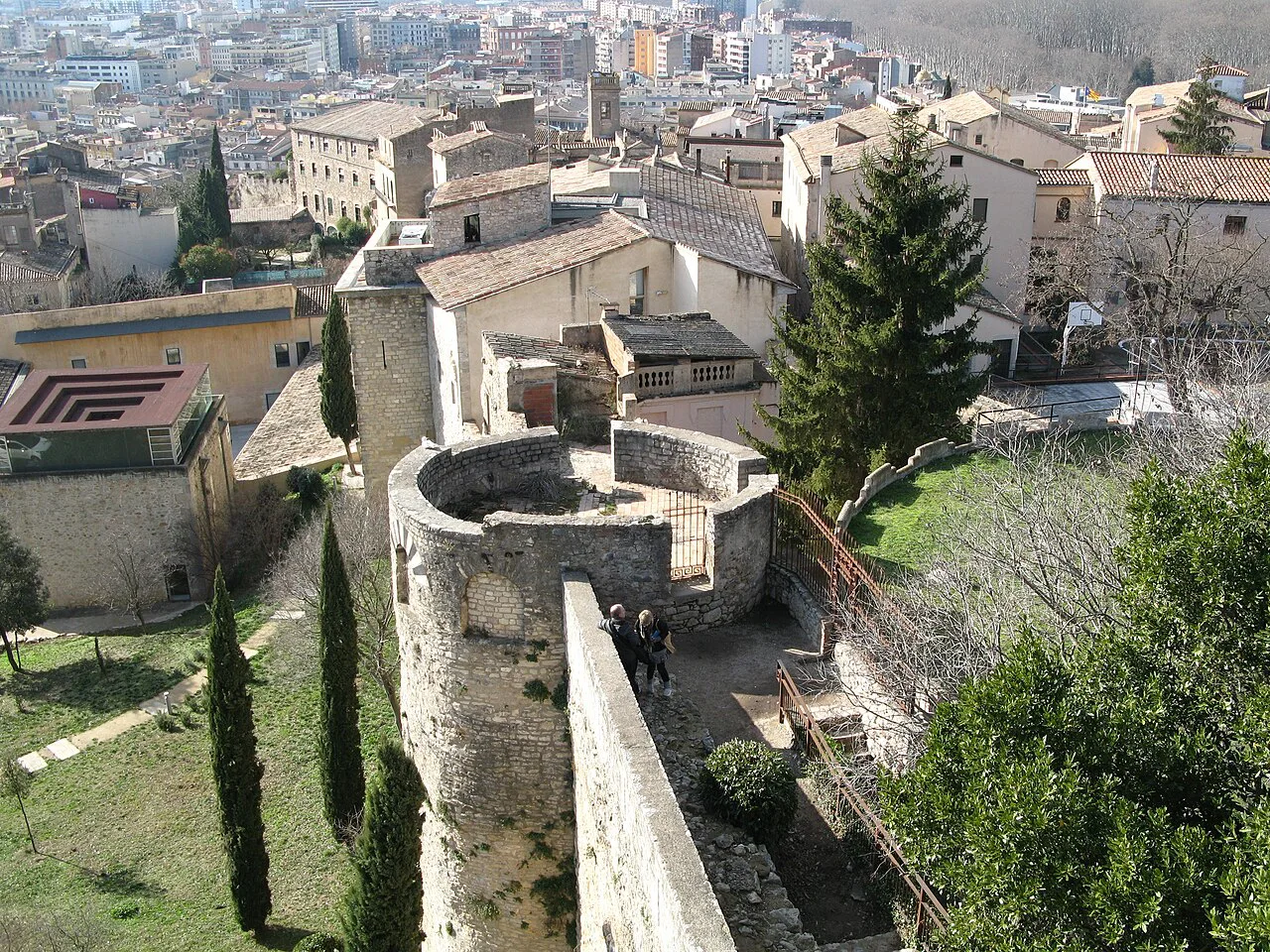 Girona's city walls and old-town rooftops seen from above.