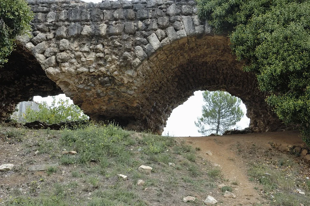 A stone arch among the ruins of the Castell de Montjuïc, Girona.