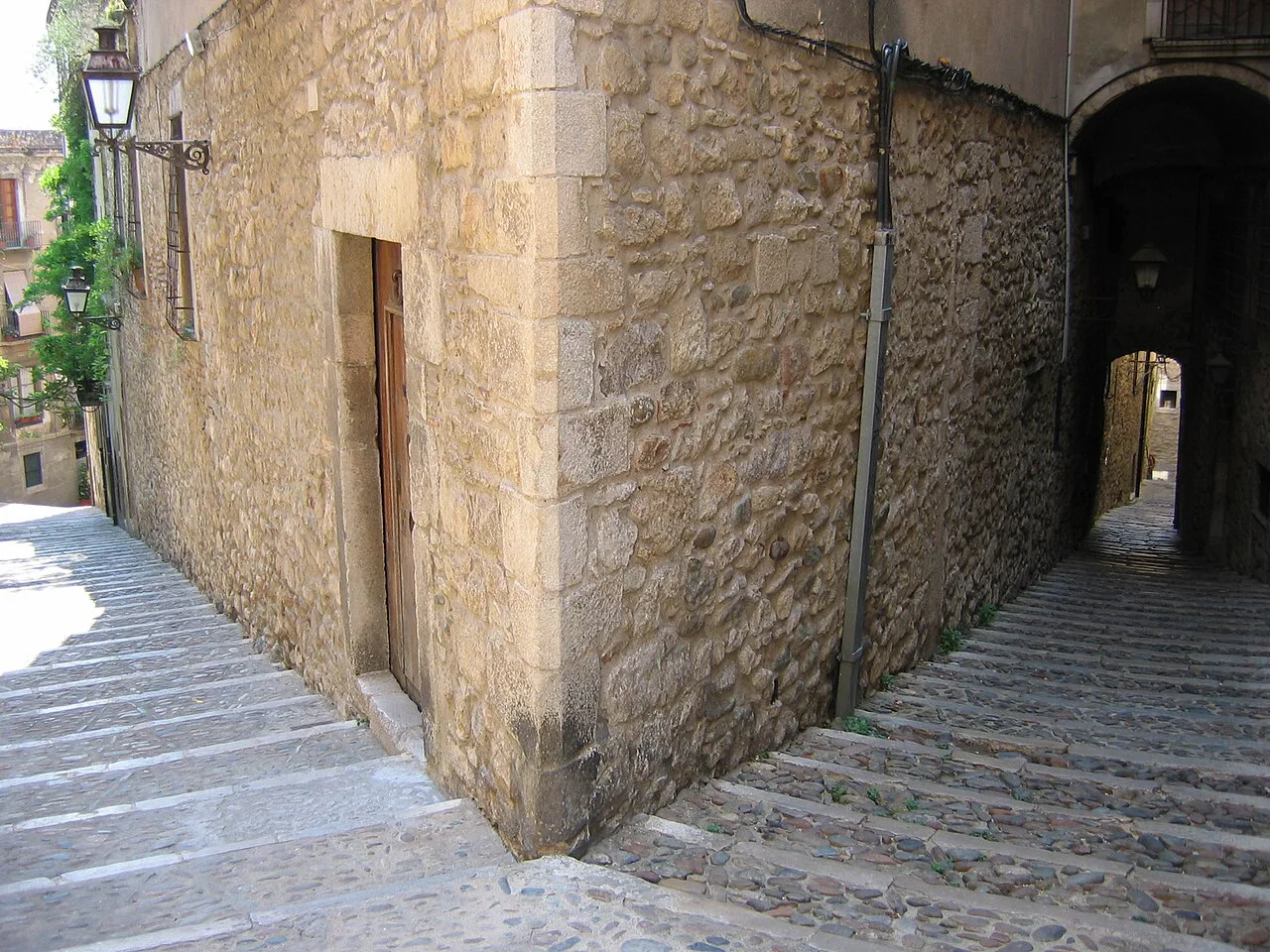 Steps and stone walls on a lane of the Call, Girona.