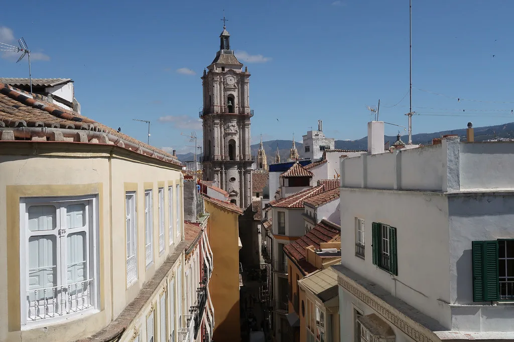 Rooftops and a church bell tower in Málaga.