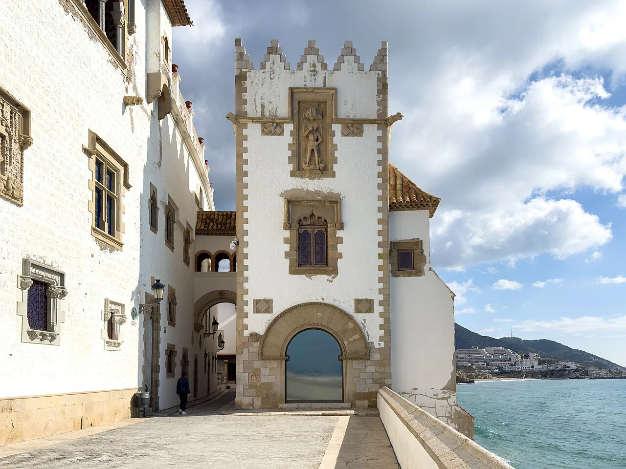 The white tower of the Palau Maricel above the sea, Sitges.