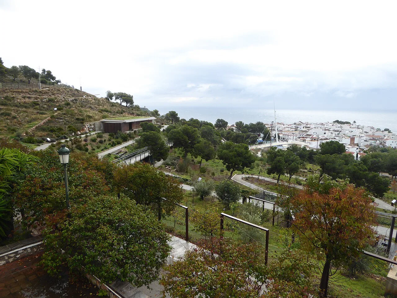 Gardens and hillside around Maro, near the Nerja Caves, with the sea beyond.