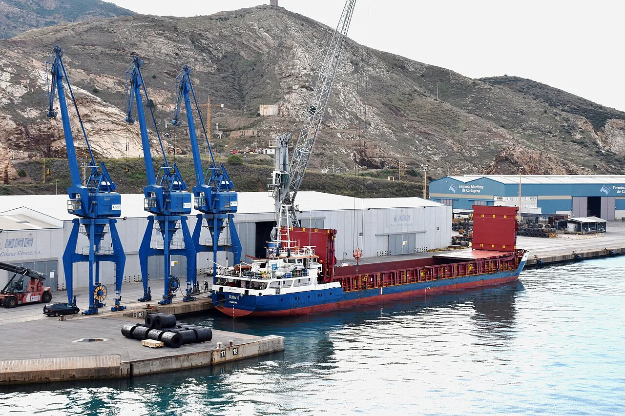 Cranes and a cargo ship in the port of Cartagena.