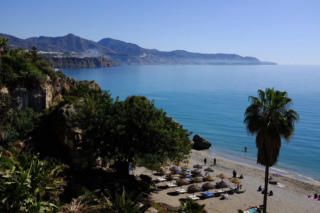 Nerja's coastline and a beach below the cliffs.
