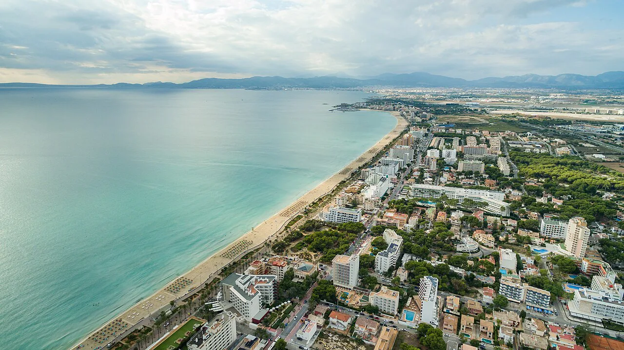 Aerial view of the long Platja de Palma beach and its hotel strip, Mallorca.