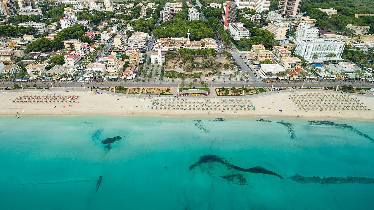 Aerial view of a beach and turquoise water on the Palma coast, Mallorca.