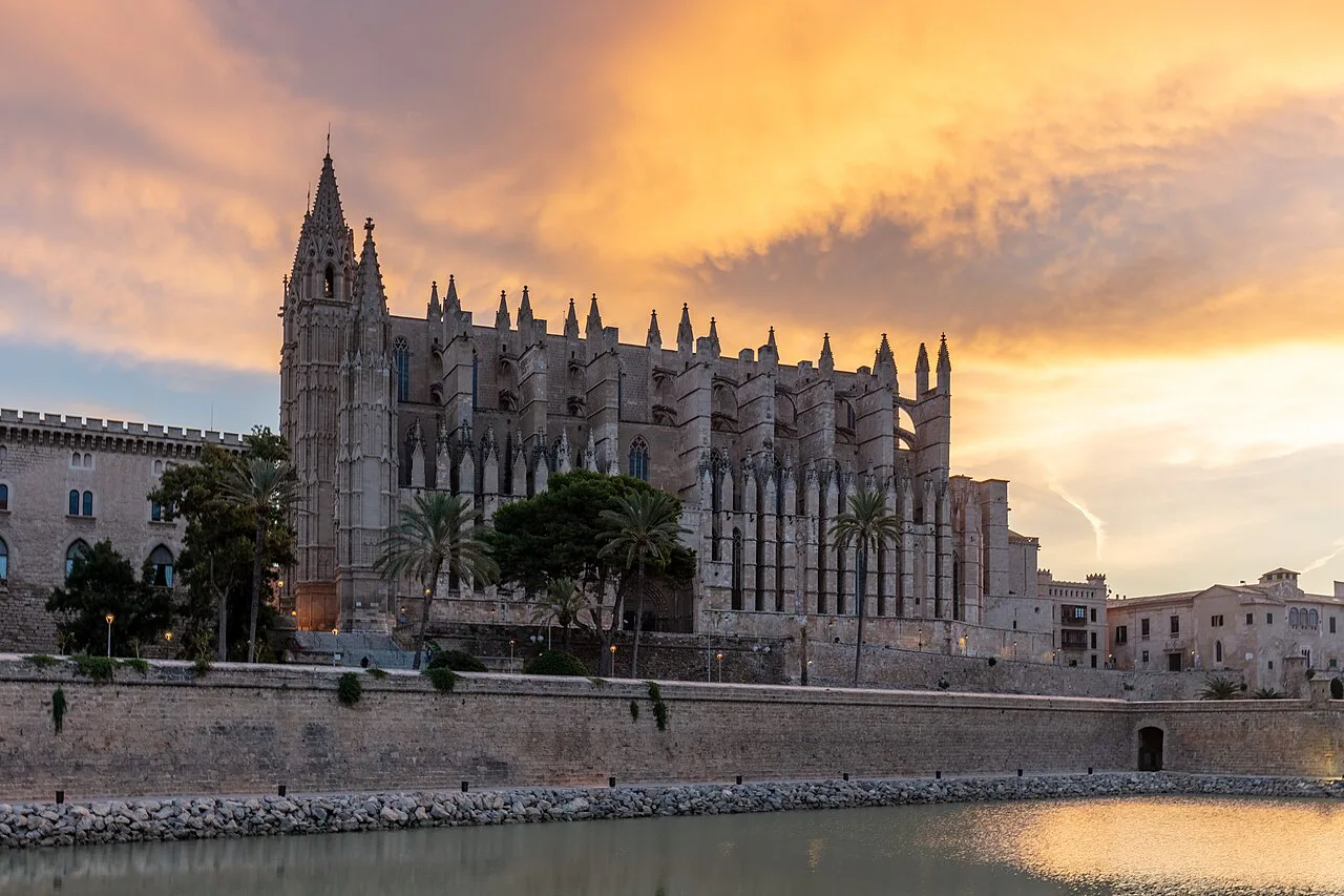 Palma Cathedral under a sunset sky.