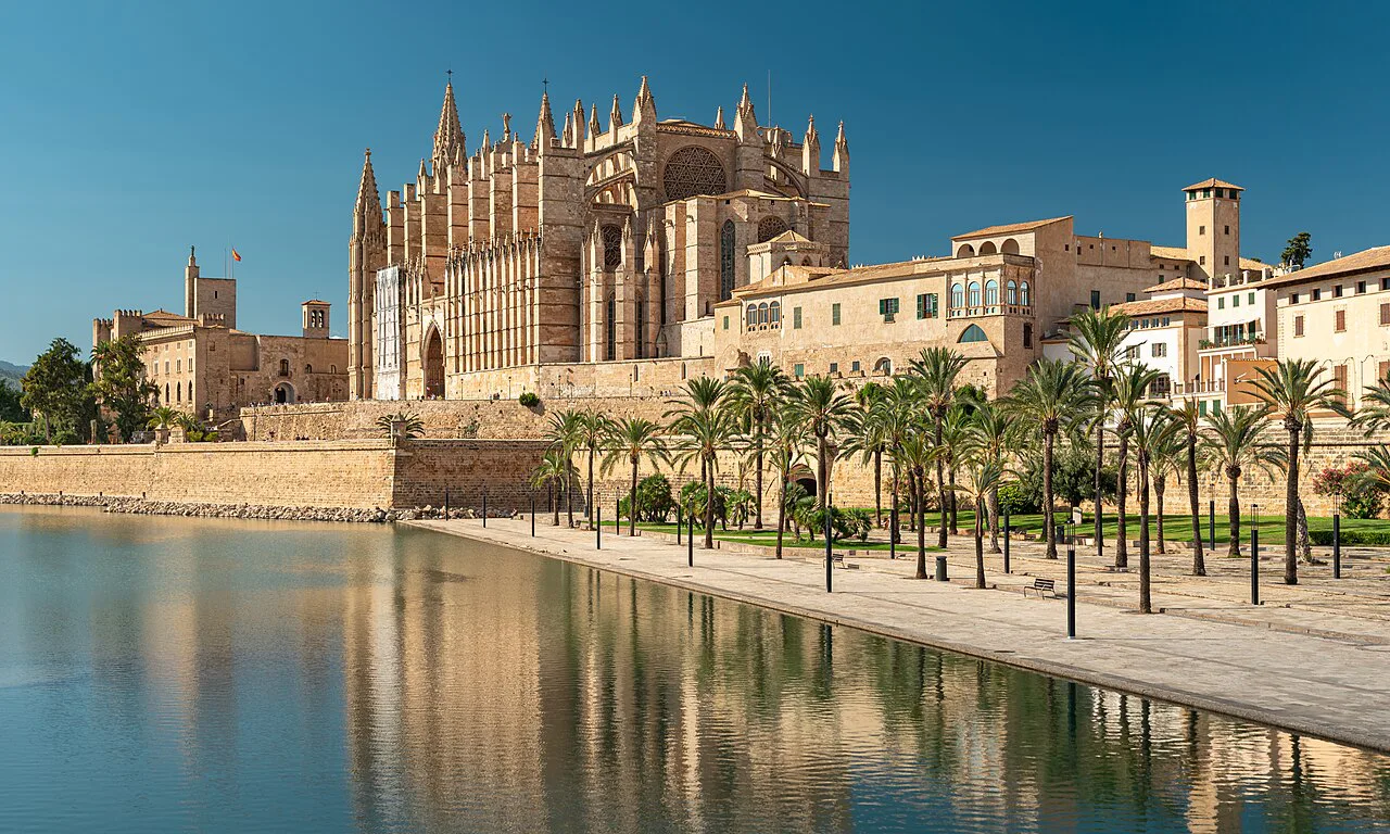Palma Cathedral (La Seu) reflected in the Parc de la Mar lake, Palma de Mallorca.