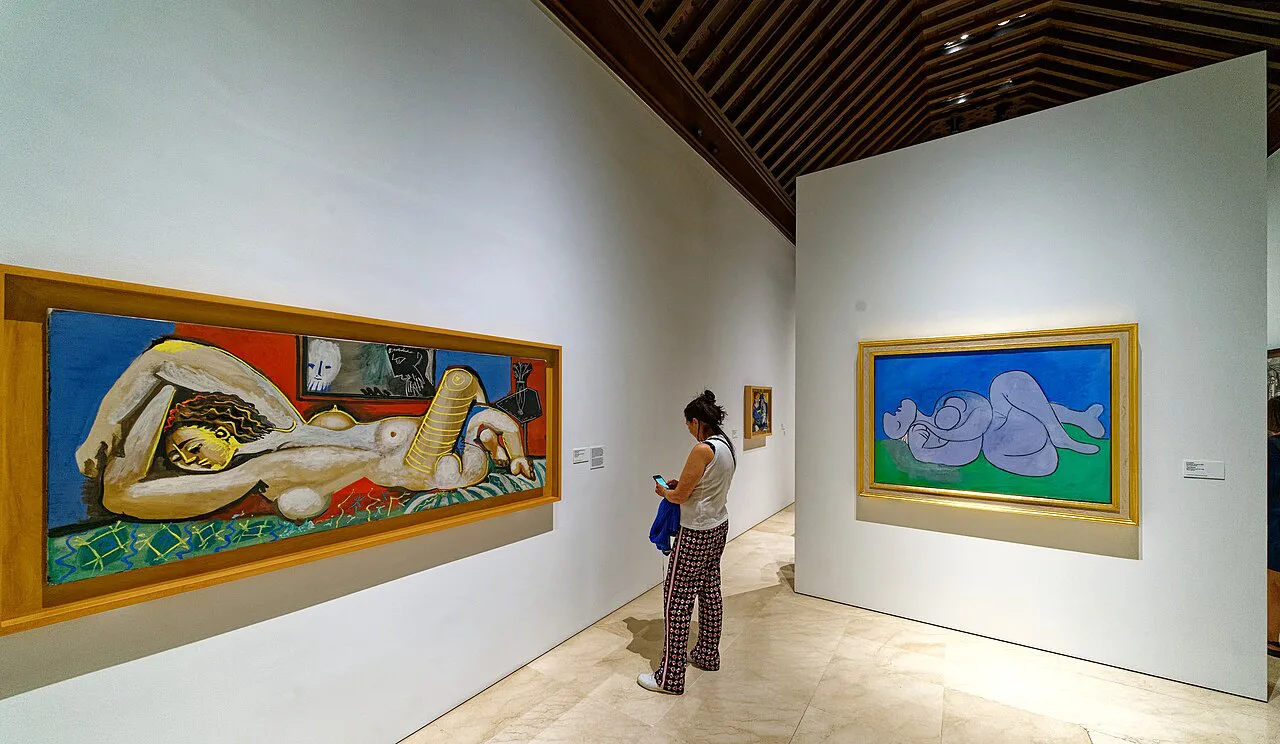 A gallery room with Picasso paintings in the Museo Picasso Málaga.