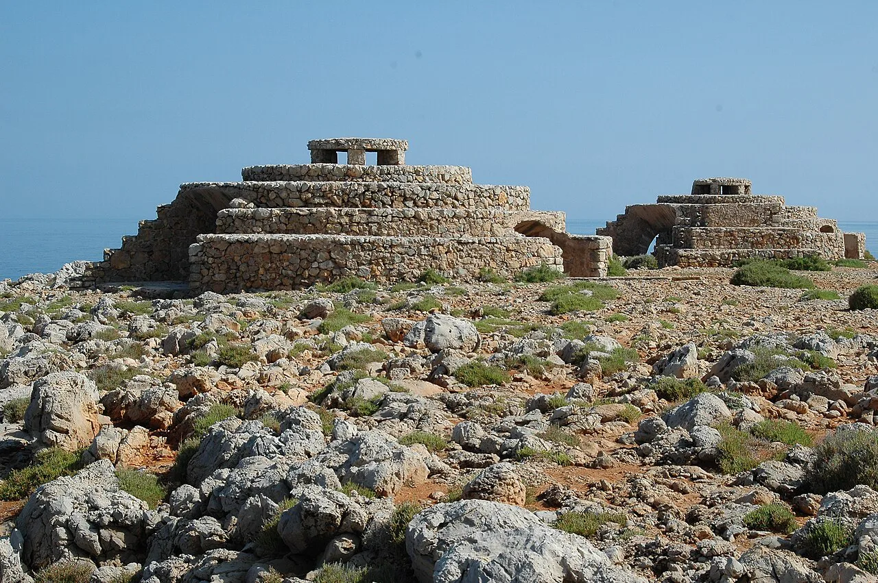 Stone bunkers on the rocky coast at Punta Nati, Ciutadella, Menorca.