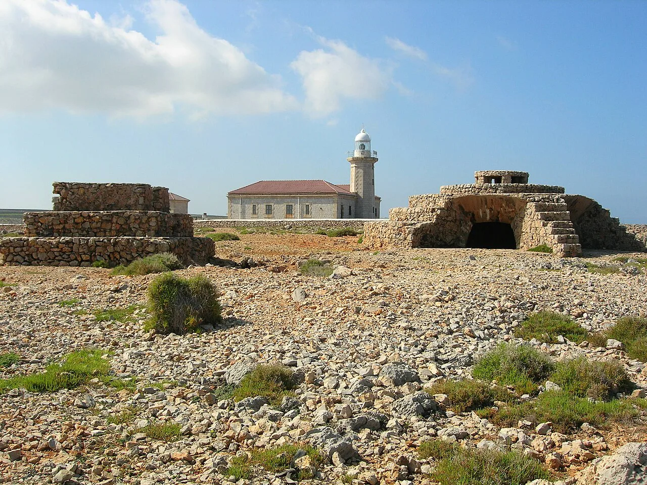 Bunkers and the lighthouse at Punta Nati, Ciutadella, Menorca.