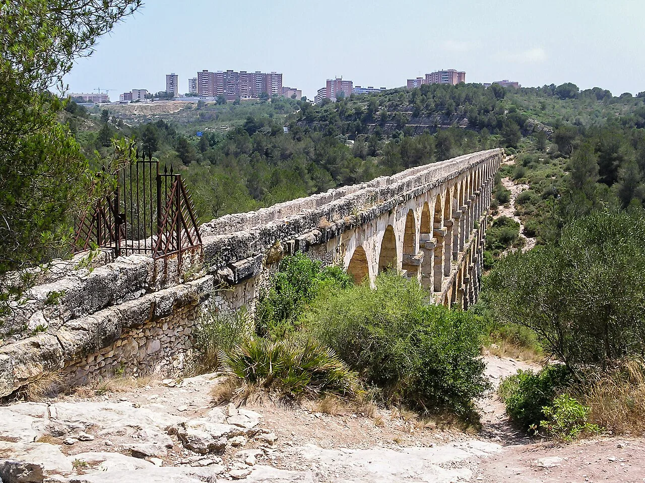 The Pont del Diable Roman aqueduct crossing the wooded valley near Tarragona.