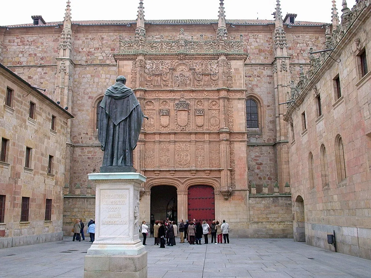 The statue of Fray Luis de León before the University of Salamanca façade.