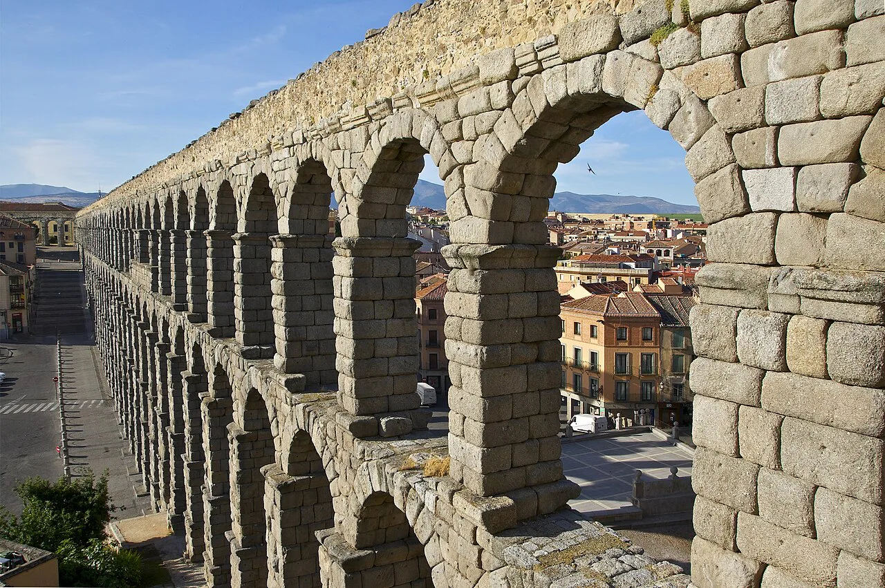 The Roman Aqueduct of Segovia above the town.