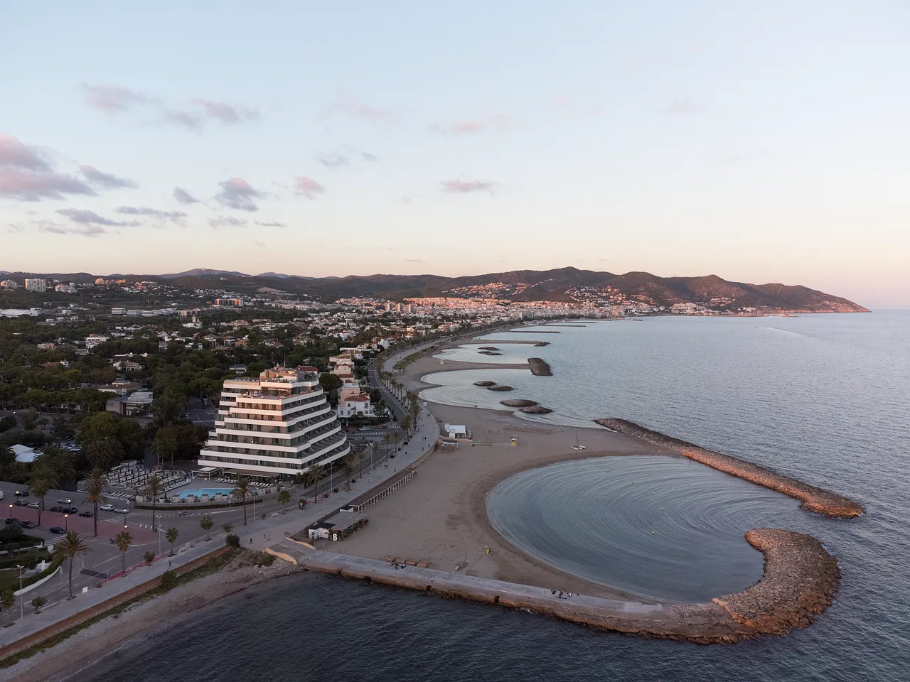 Les Anquines beach and the ME Sitges Terramar hotel, Sitges.
