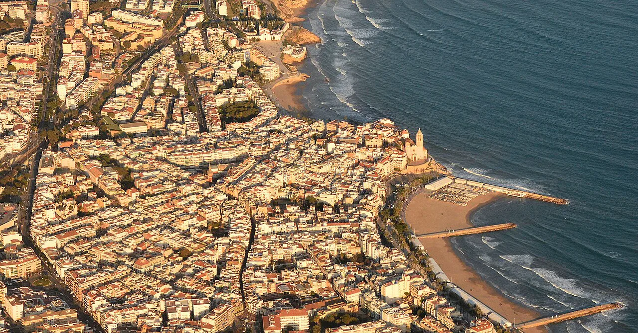 Aerial view of Sitges old town, its church and beaches.