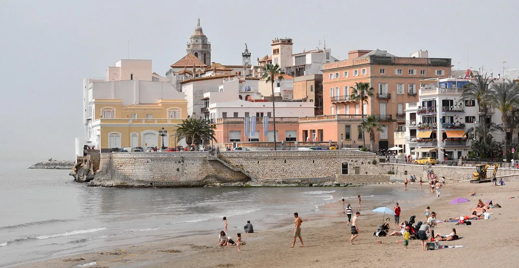 Sitges beach and the old town with the parish church.