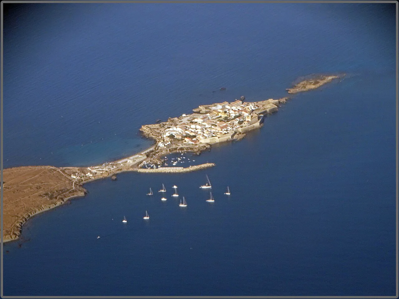 Aerial view of Tabarca Island and moored boats.