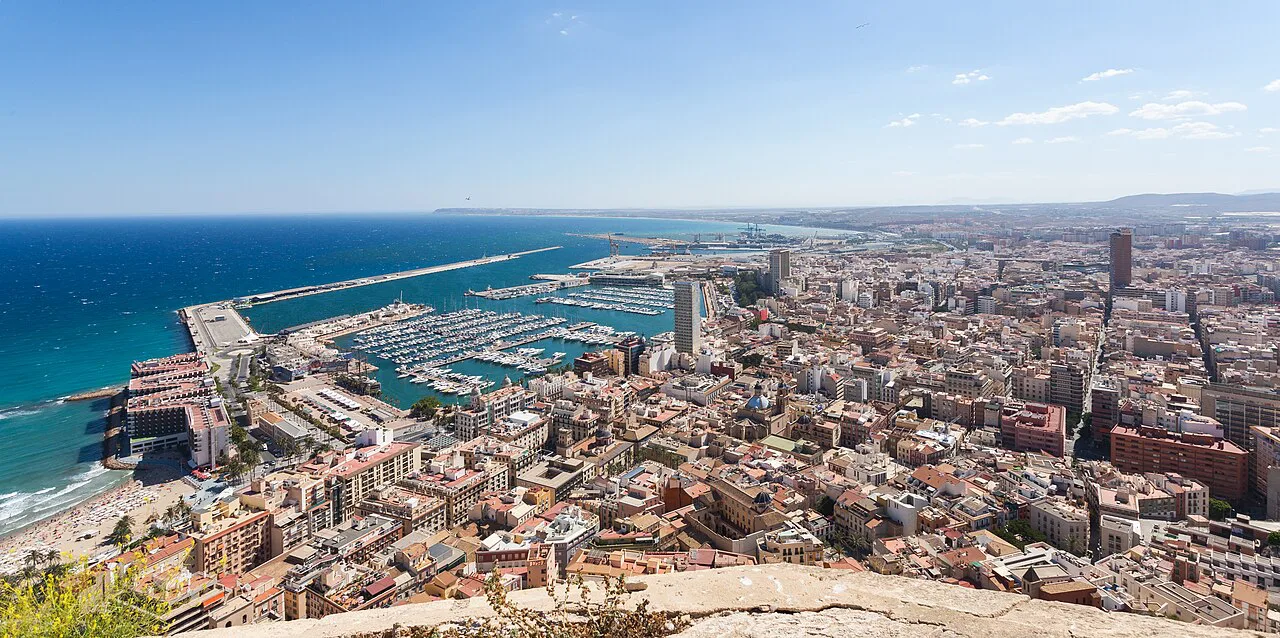 The rooftops and seafront of Alicante seen from above.