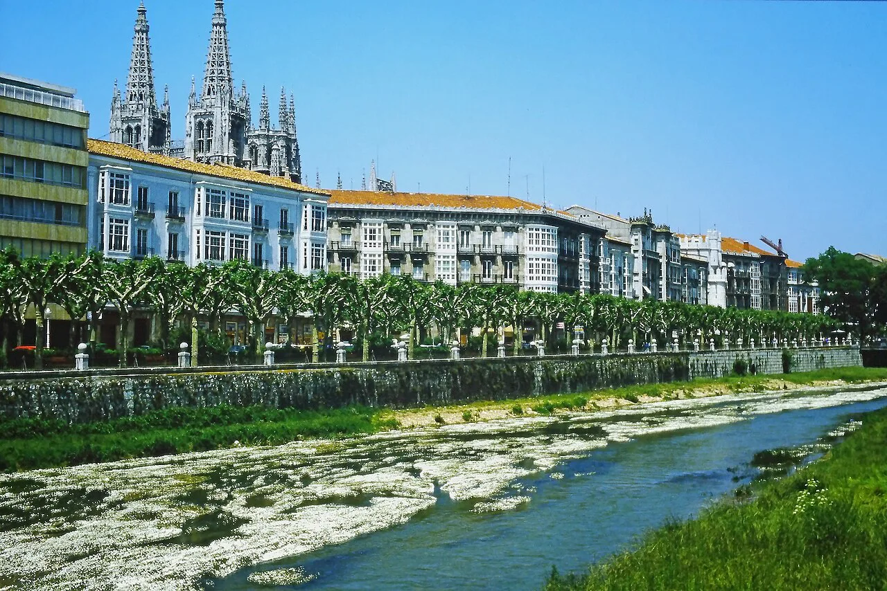 The Arlanzón river in Burgos with the cathedral spires behind.