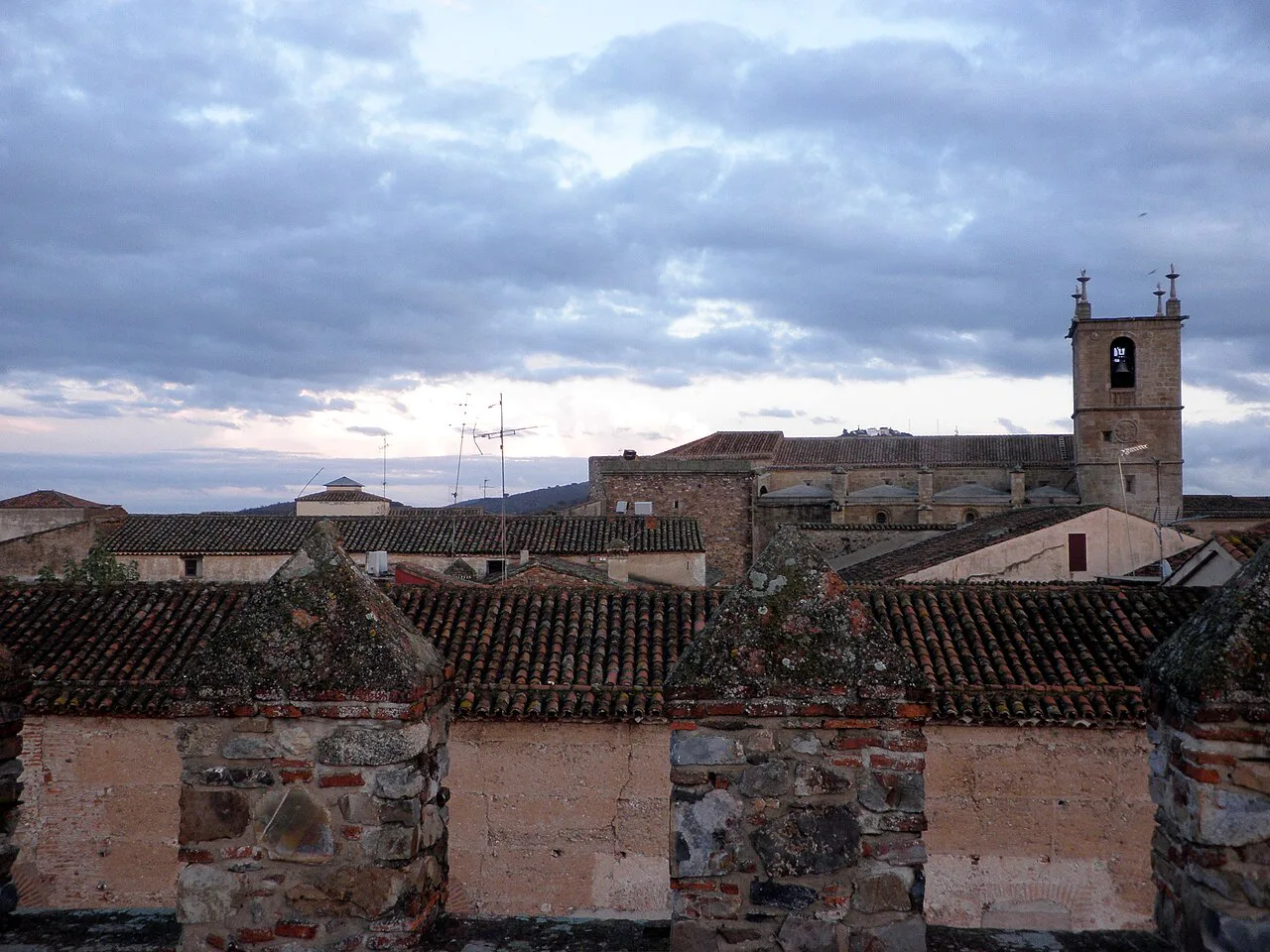 Rooftops and a church tower in the old town of Cáceres.