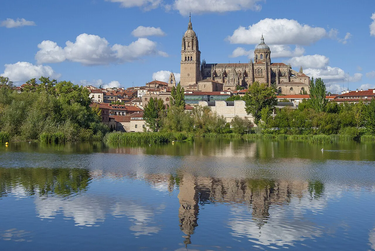 Salamanca's New Cathedral reflected in the Tormes river.