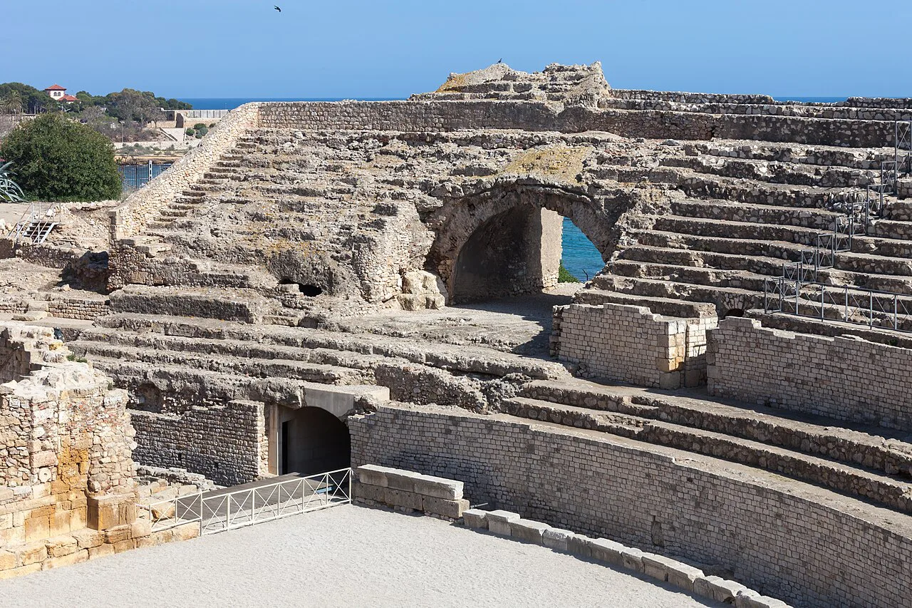 Stone seating and arches of the Roman amphitheatre of Tarragona.