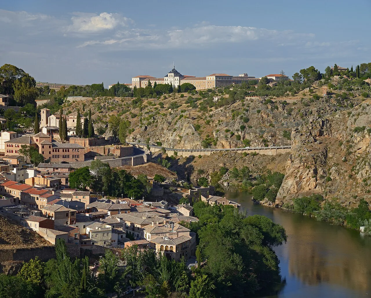 Toledo above the Tagus gorge with the Academia de Infantería on the far bank.