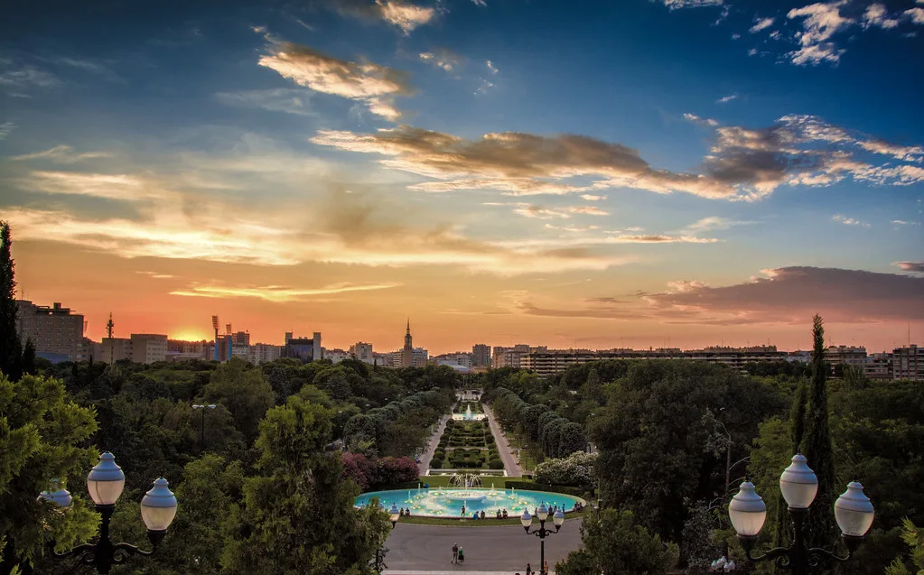 Sunset over a park with fountains in Zaragoza.